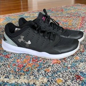 Under Armour, woman’s 9.5 Micro G shoes.